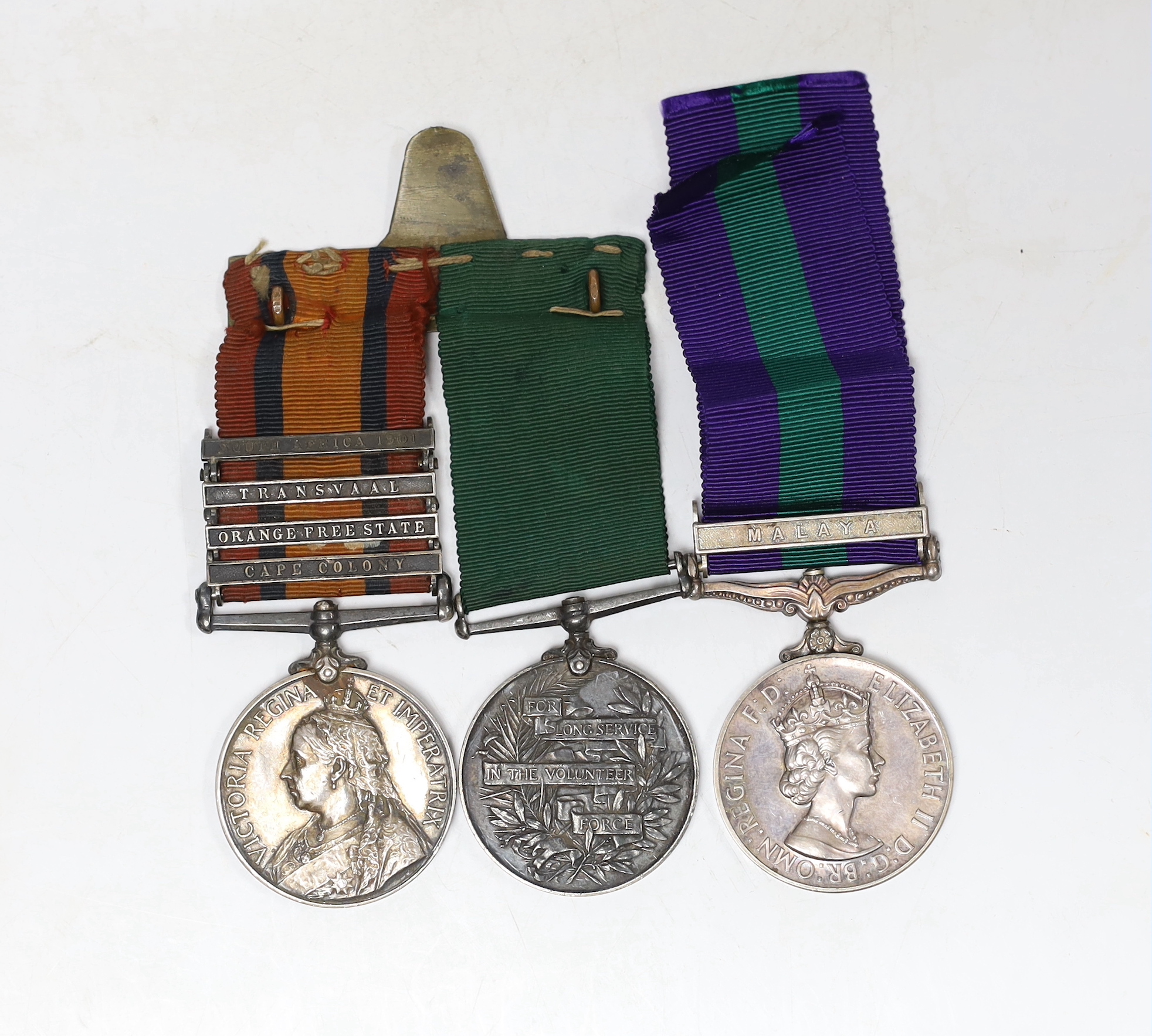 Three medals. A pair to Pte. T. Gibson, Vol. Coy. Border Regt. comprising the South African Medal with bars for Cape Colony, Orange Free State, Transvaal and South Africa 1901, and a Volunteer Force Long Service Medal, t